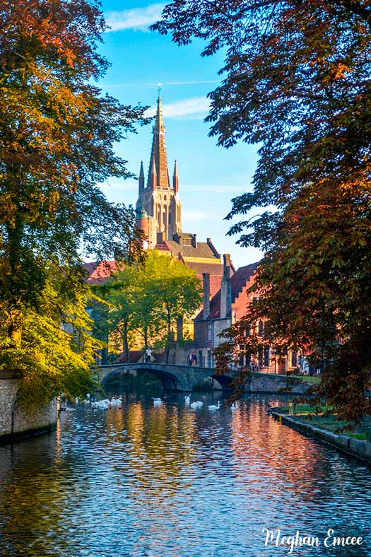 Picturesque Bruges! What A Magical Town! #minnewaterbruges #lakeoflovebruges #churchofourlady #travelinspirationphotograph