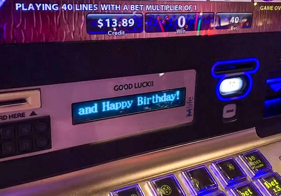 the best vegas hacks of all to make money in vegas: go to the vegas on your birthday. A closeup picture of the slot machine. On the small screen, it is written Happy Birthday! Above it you can see the available credit is $13.89.