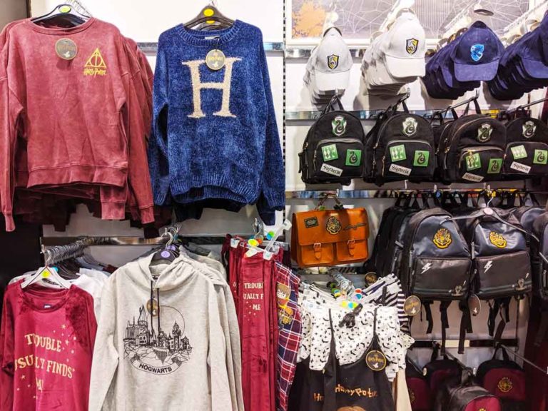 harry-potter-gear-scotland-souvenir from primark: sweaters on hangers and hats, and bags on hooks