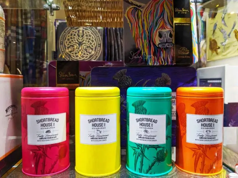scottish-shortbread-scotland-souvenir shortbread house cookies in colourful vibrant neon tins on shelf