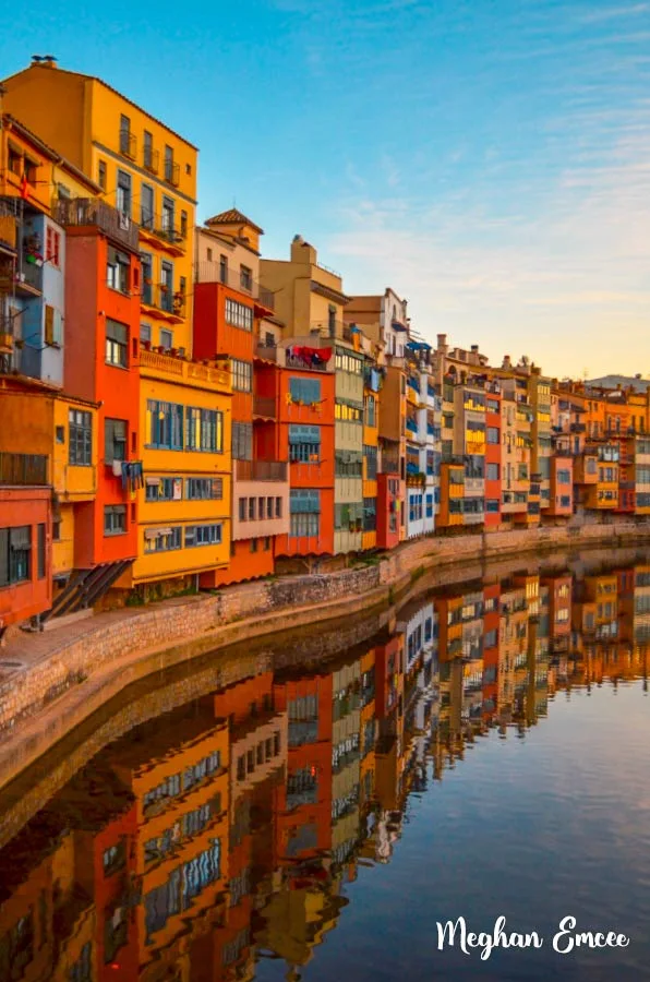 Discover Girona Spain! The picture perfect city with rich history, GoT links, and lion statues! #gironaspain #daytripfrombarcelona #sunsetviews #travelinspirationphotographt