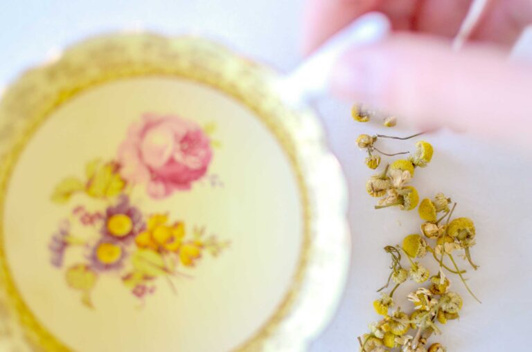 hand-on-teacup-chamomile