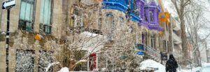 featured image: snow in montreal of colourful painted homes in montreal