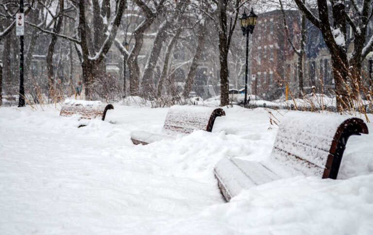 benches completely snow covered in montreal winter