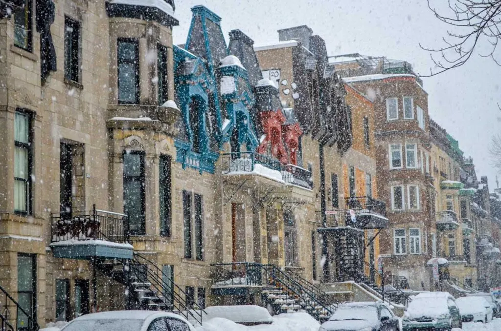 Montreal winter blizzard with colorful painted homes
