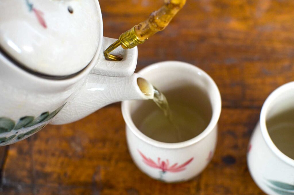 pouring green tea - best teas for anxiety