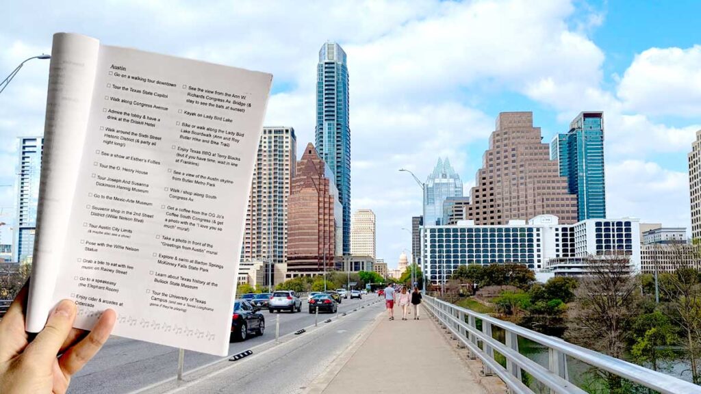 a hand holding a booklet of paper, a texas city guide and checklist, this page is open to the austin city checklist and guide with the congress bridge and austin skyline in the background