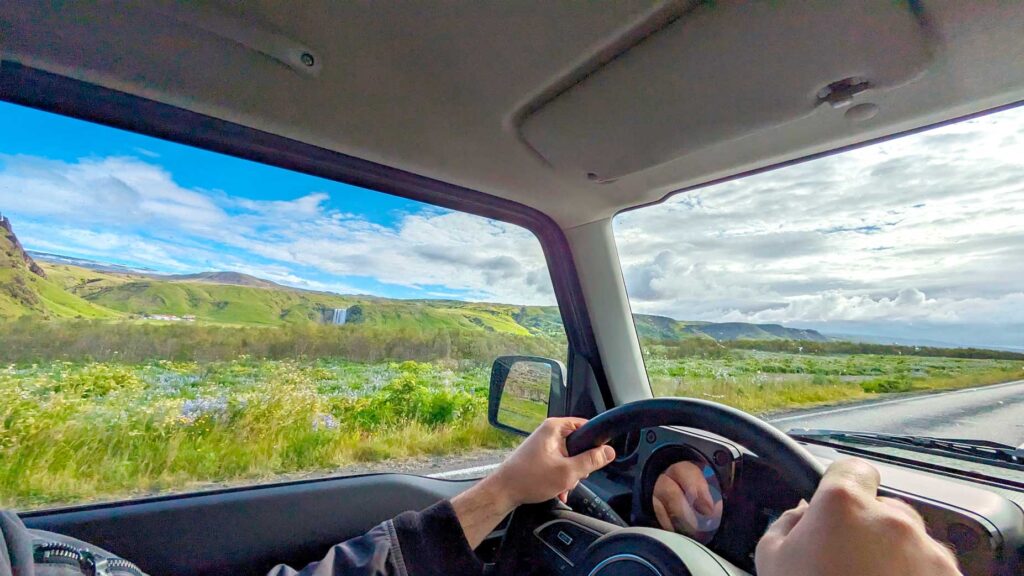 driving-by-skogafoss-in-Iceland