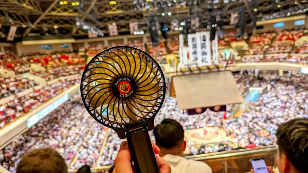 handheld-fan-at-sumo-tournament-in-japan