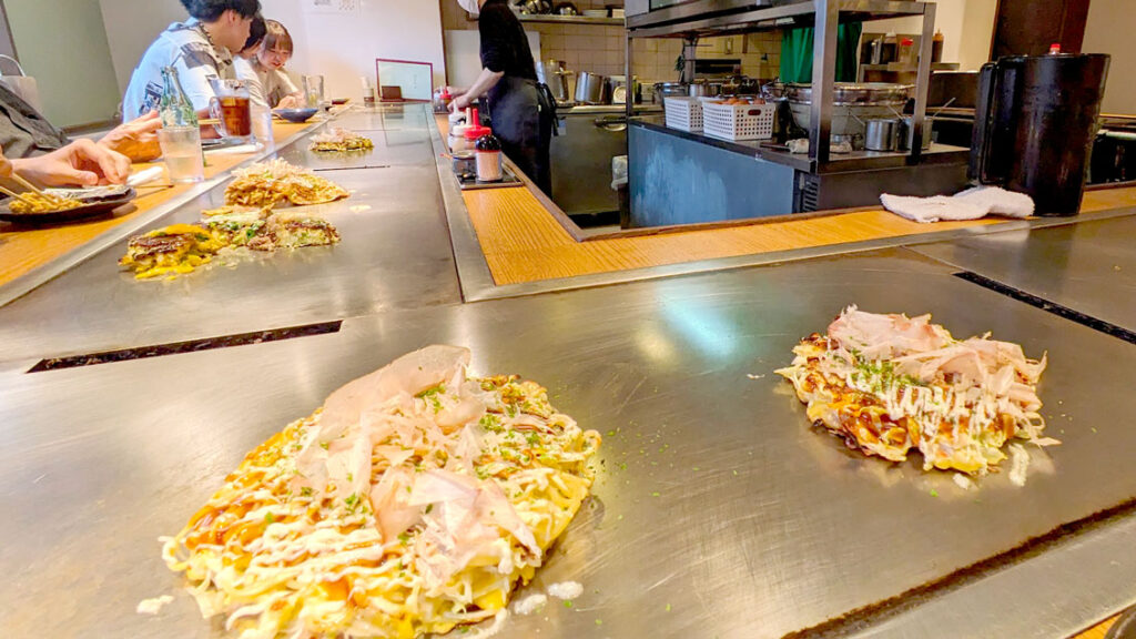 okonomiyaki-made-in-front-of-you-in-japan-must-try