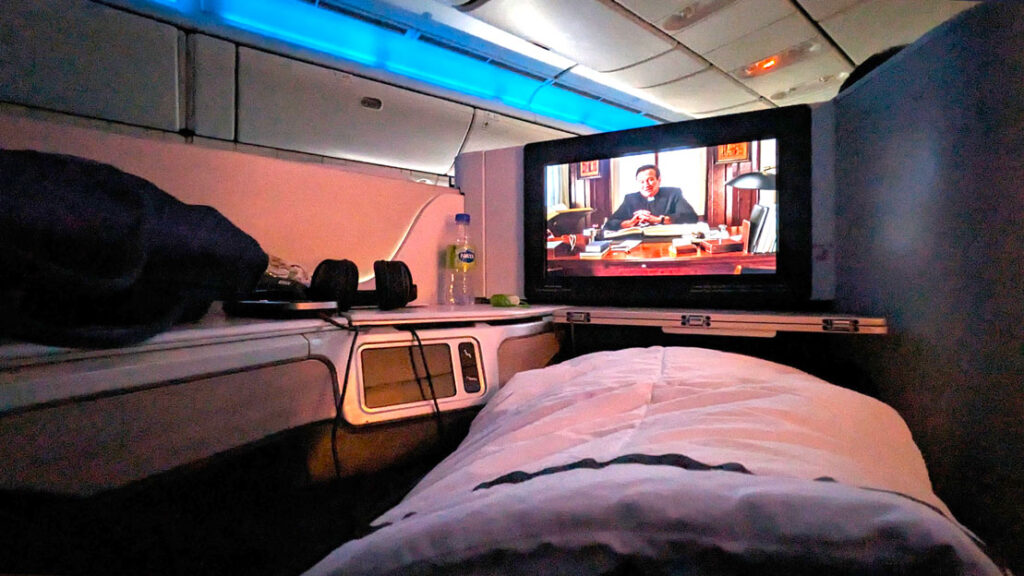 private-cubby-watching-a-movie-in-business-class