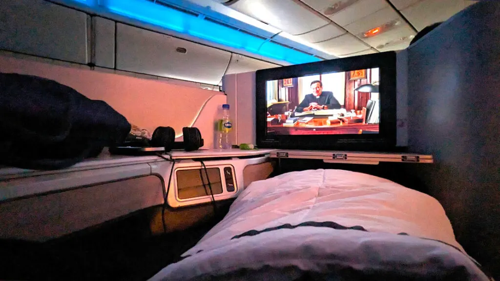 private-cubby-watching-a-movie-in-business-class