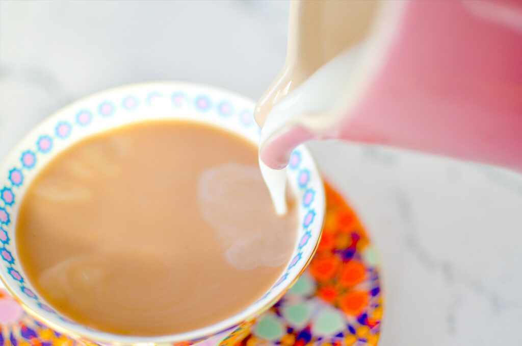 pouring-milk-into-teacup-breakfast-teas
