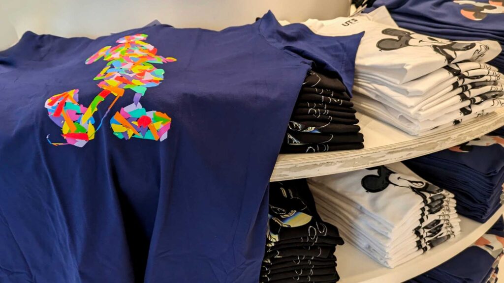 disney-souvenir-idea-buy-a-themed-tshirt-before-arriving-a-lot-of-folded-t-shirts--one-is-opened-up-to-display-mickey-mouse