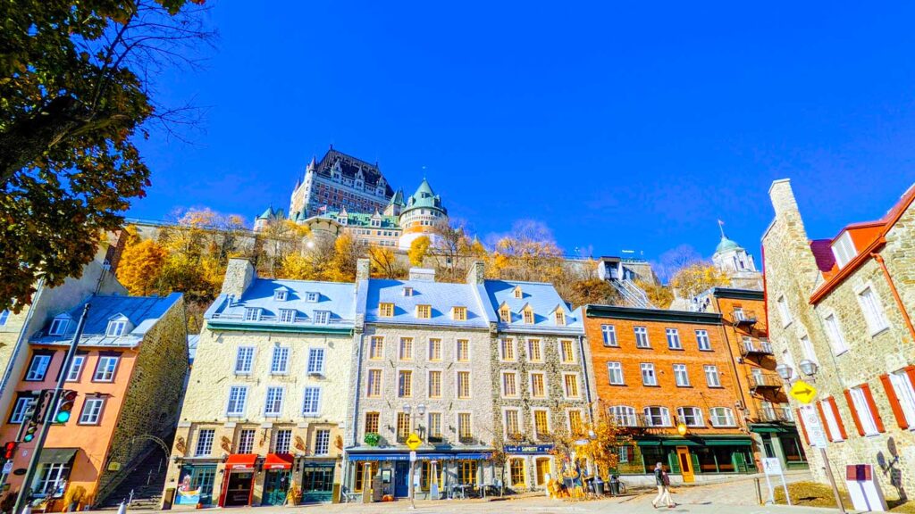 fairmont-chateau-frontenac-in-quebec-city-towering-above-the-colourful-rooftop-buildings-in-lower-town-on-a-fall-day