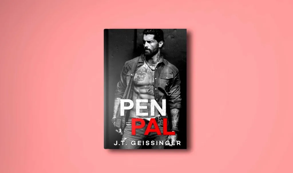 hardcover book on a plane pale pink/ red background to compliment the black and white cover of Pen Pal by J.T. Geissinger. 