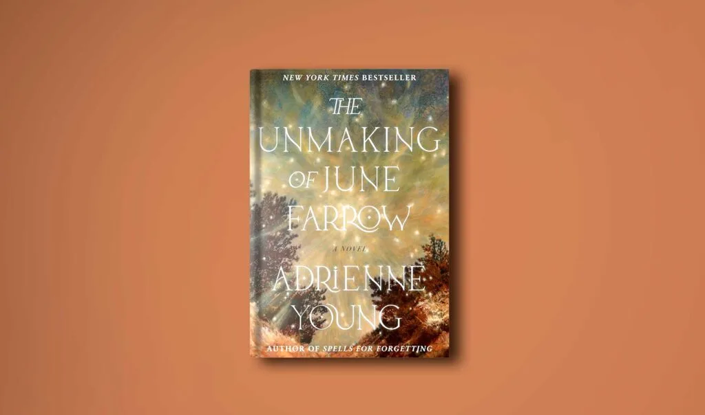 hardcover book on a plane burnt orange background (to match the details on the book cover of the unmaking of june farrow by adrienne young)