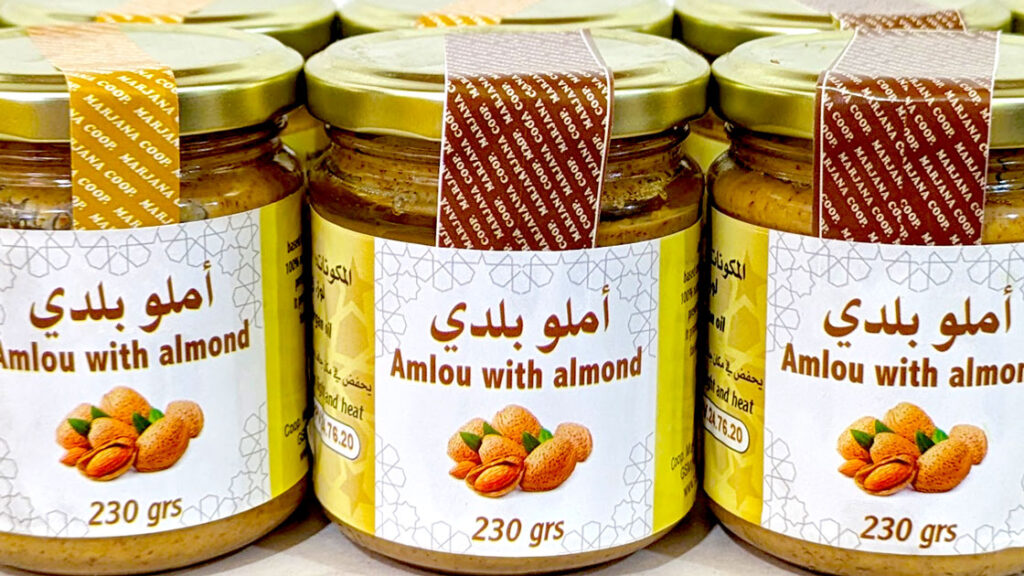 a close up of three jars of amlou 