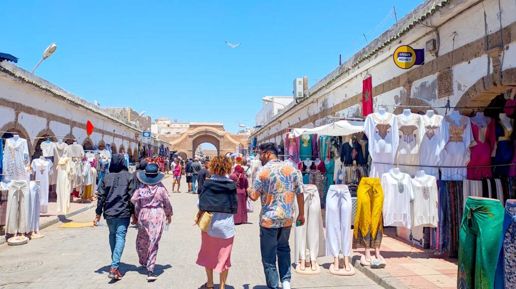 walking through the market in Essaouira it's busy but the streets are wide enough and its all outside. There are many different people walking by all wearing something different, from traditional djabella to a midi skirt. One of the shops is even selling loose fitting pants and shirts