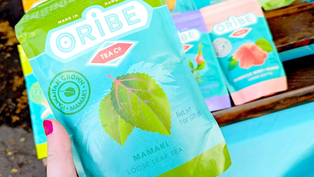 a hand holding up a package for mamake tea. The mamake tea leaf is picture on the front of the packaging. The brand is Oribe