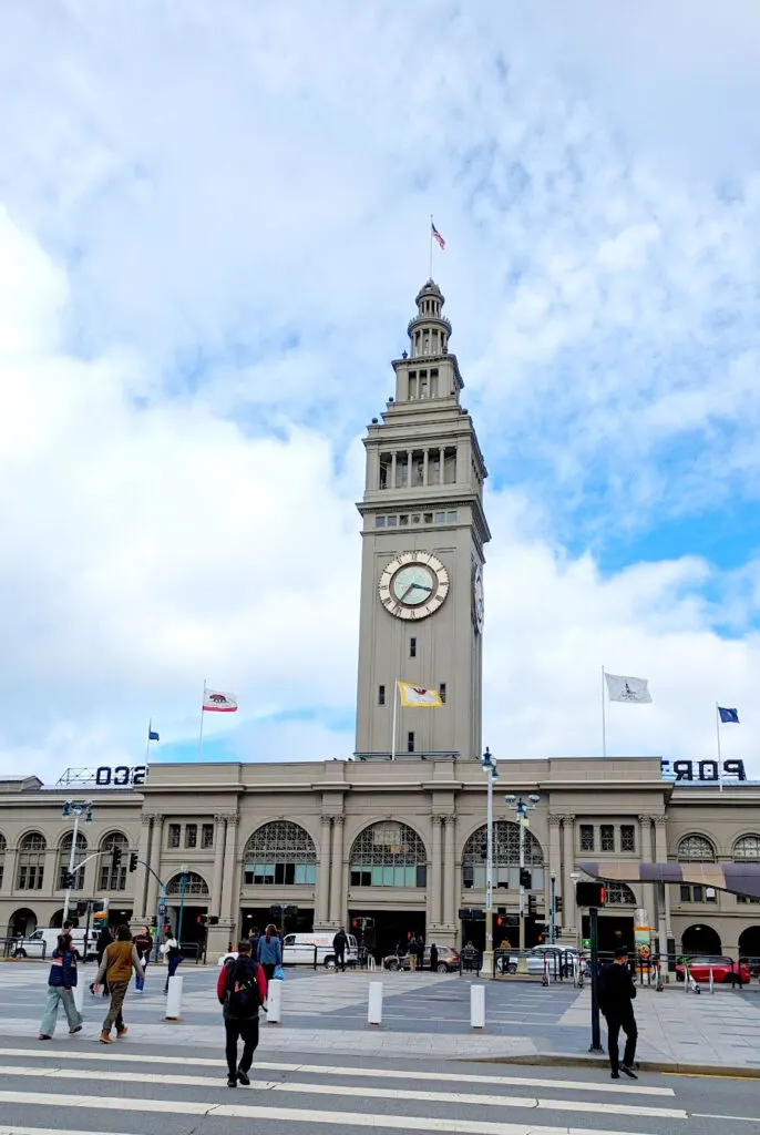 The view of the Ferry Building from across the street. It's a long building with a clock tower in the center.